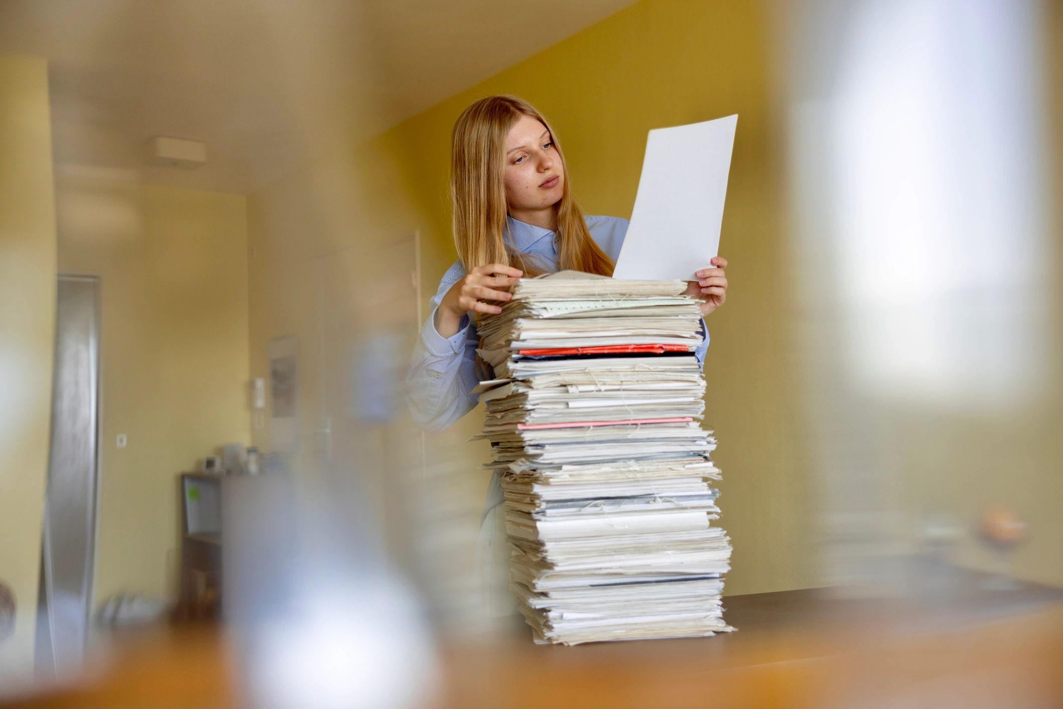 Municipal staff member reviewing documents in an office setting